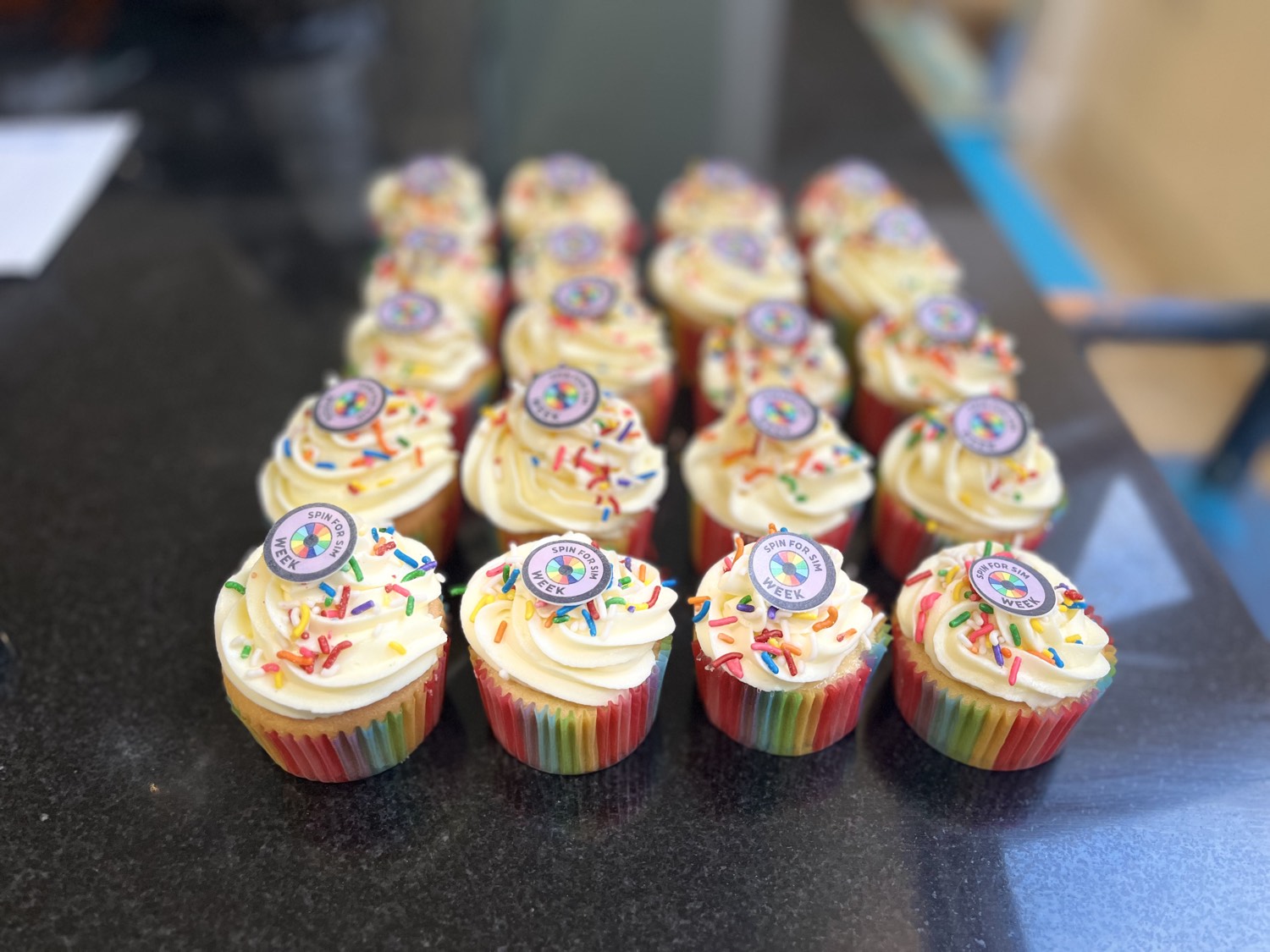 Rows of Spin for SIM Week cupcakes ready for the team